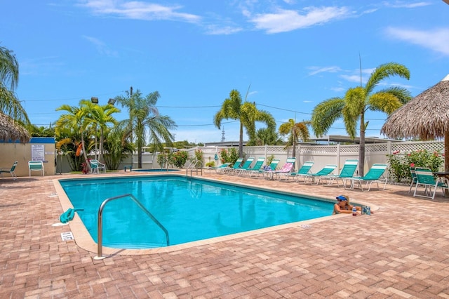 view of swimming pool with a patio