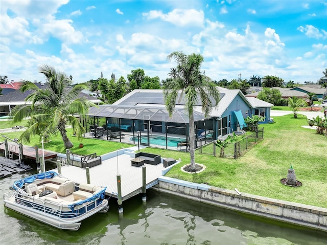 view of dock featuring glass enclosure, a lawn, and a water view