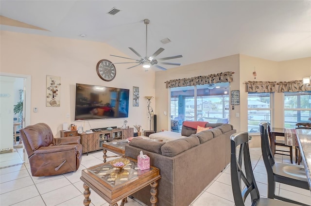 living room with high vaulted ceiling, ceiling fan, and light tile floors