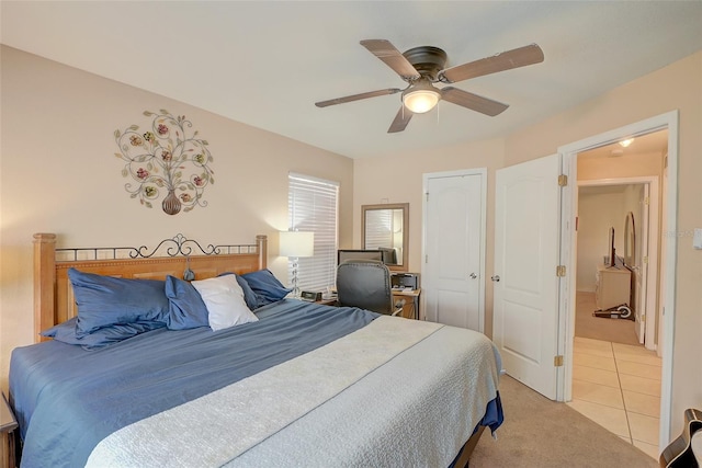 bedroom with ceiling fan, a closet, and light colored carpet