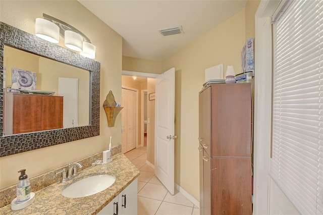 bathroom featuring tile flooring and vanity