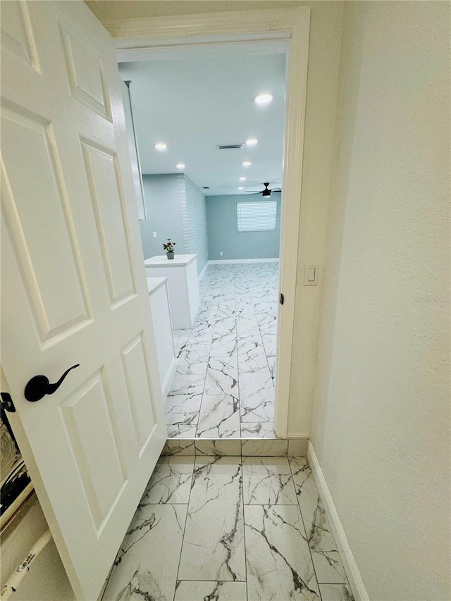 hallway with light tile flooring