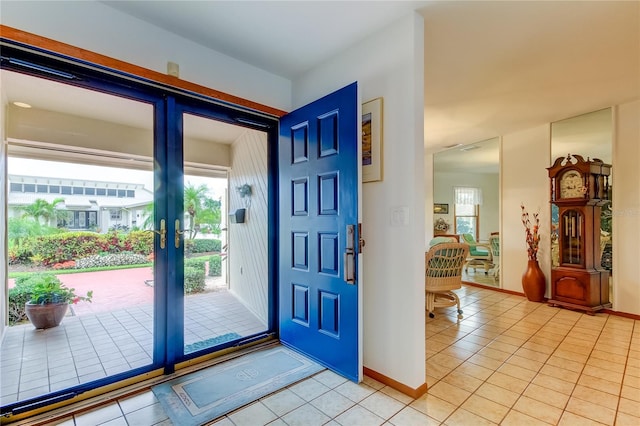 foyer with light tile patterned floors