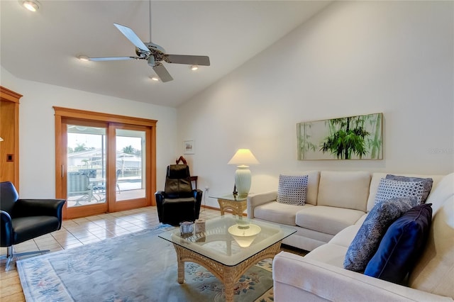 living room with light tile patterned floors, high vaulted ceiling, and ceiling fan