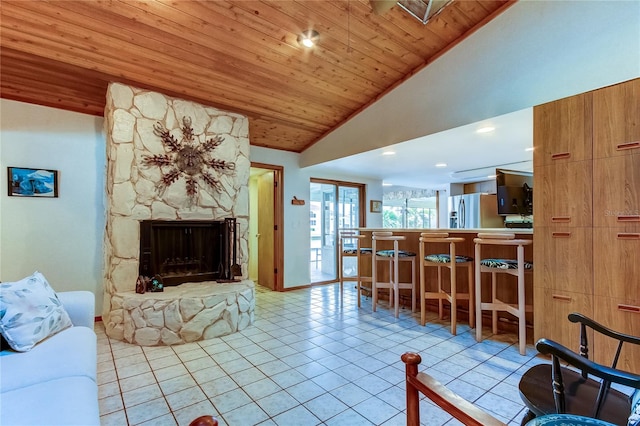 living room with high vaulted ceiling, a stone fireplace, wood ceiling, and light tile patterned floors