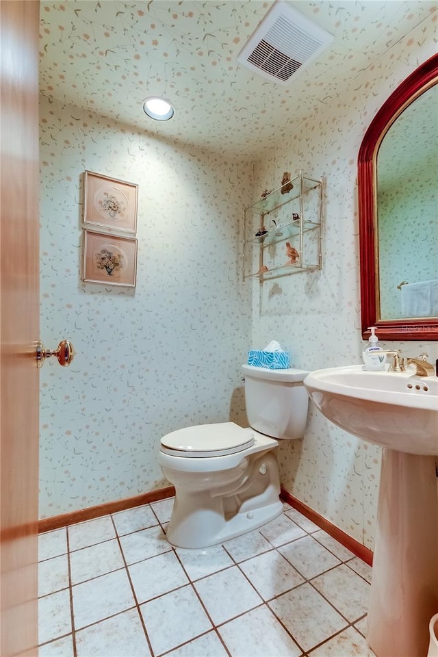 bathroom with tile patterned floors and toilet