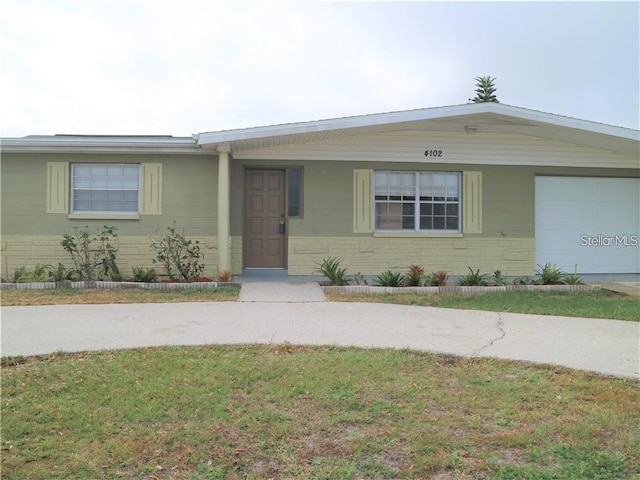 view of front of home with a garage and a front yard