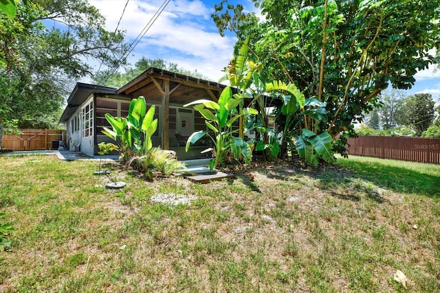 view of yard with a sunroom