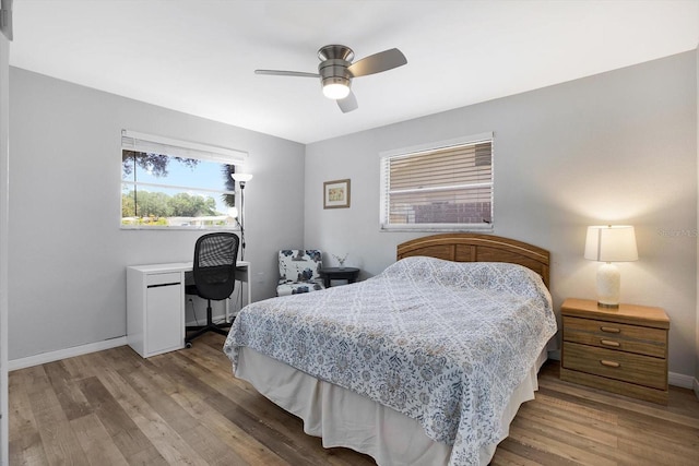 bedroom featuring ceiling fan and hardwood / wood-style flooring