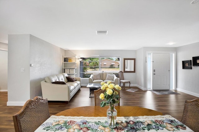 living room with dark hardwood / wood-style floors