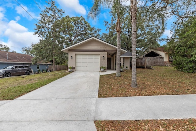 ranch-style home featuring a front yard and a garage