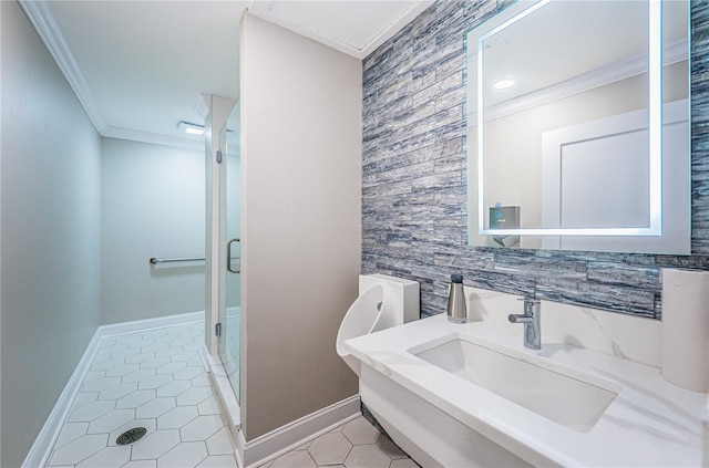 bathroom featuring tile patterned flooring, crown molding, sink, and an enclosed shower