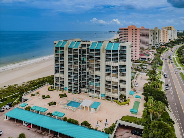 bird's eye view with a water view and a view of the beach