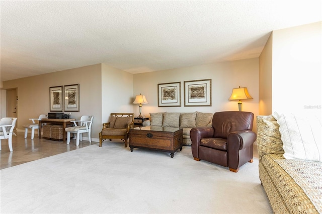 carpeted living room featuring a textured ceiling