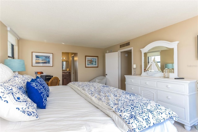 bedroom featuring a textured ceiling