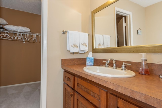 bathroom featuring vanity and a textured ceiling