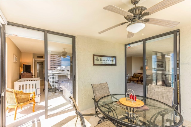 interior space with ceiling fan