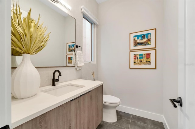 bathroom with tile patterned floors, vanity, and toilet