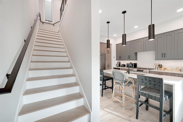 stairs with hardwood / wood-style flooring