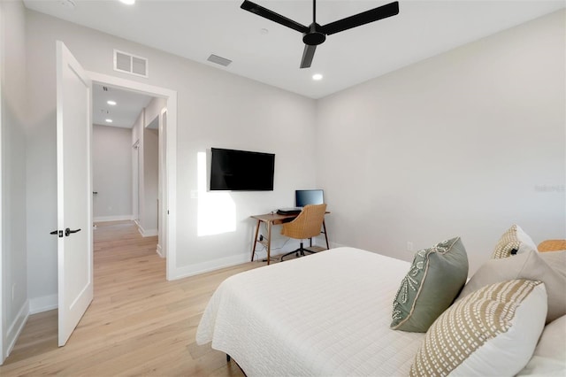 bedroom with ceiling fan and light wood-type flooring