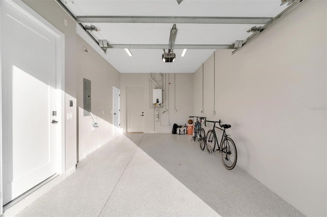 garage featuring electric panel, a garage door opener, and water heater