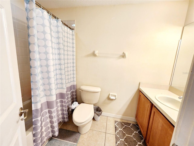 bathroom featuring tile patterned floors, vanity, and toilet