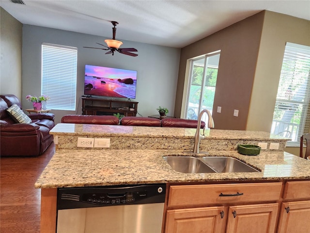 kitchen featuring sink, ceiling fan, wood-type flooring, stainless steel dishwasher, and light brown cabinets