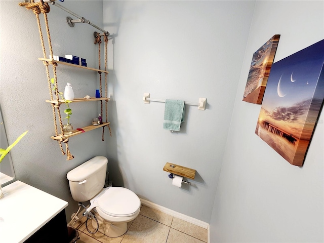 bathroom featuring tile patterned floors, vanity, and toilet