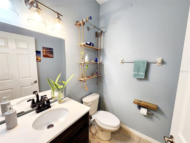 bathroom with tile patterned floors, vanity, and toilet