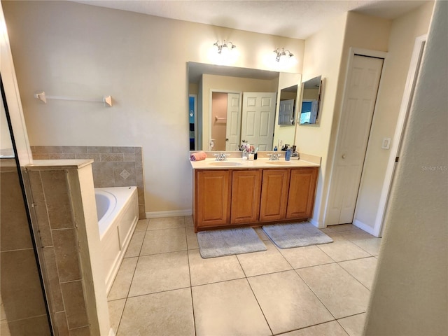 bathroom featuring vanity, tile patterned floors, and a bathing tub