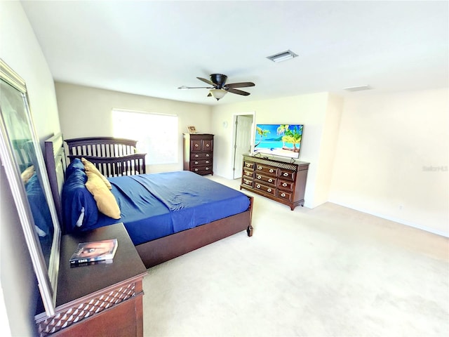 bedroom featuring ceiling fan and light colored carpet