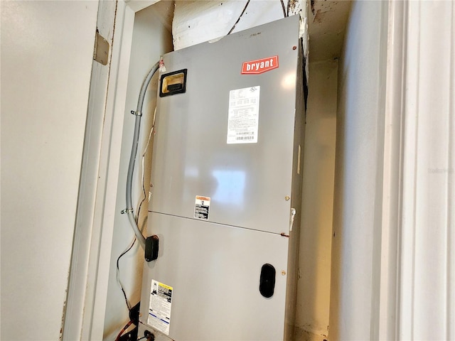 utility room featuring heating unit