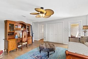 home office featuring ceiling fan and light hardwood / wood-style floors