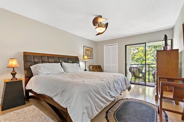 bedroom with wood-type flooring, a closet, ceiling fan, and access to exterior