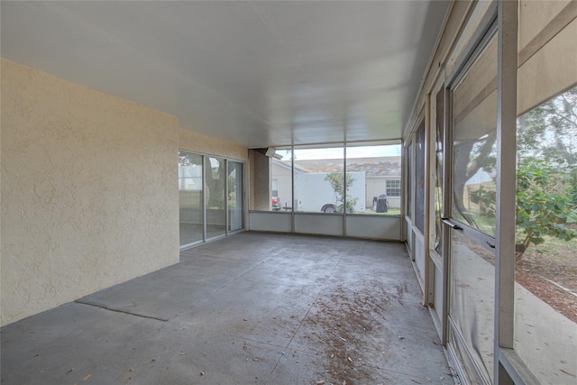 unfurnished sunroom featuring a healthy amount of sunlight