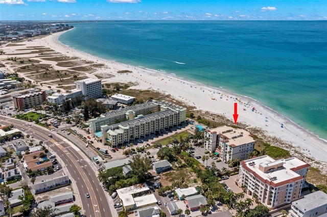 bird's eye view featuring a view of the beach and a water view