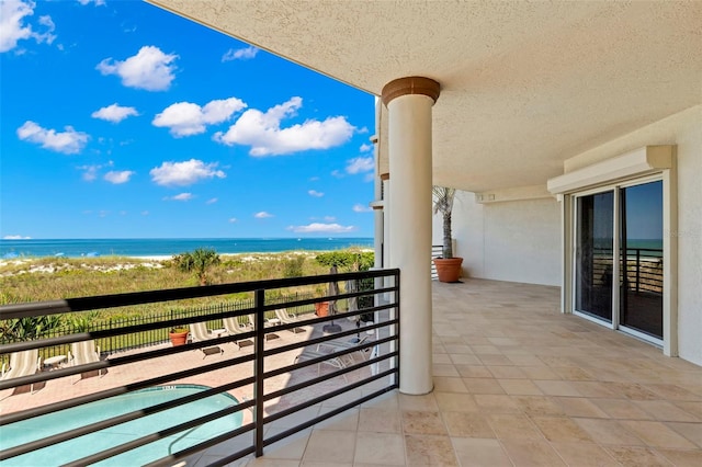 balcony featuring a water view