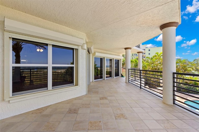 view of patio with a balcony