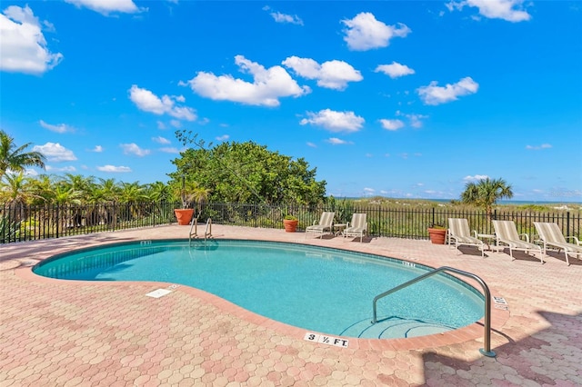 view of swimming pool featuring a patio