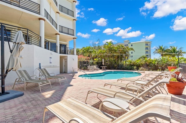 view of swimming pool with a patio area