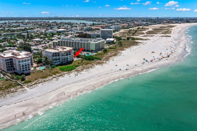 birds eye view of property featuring a view of the beach and a water view