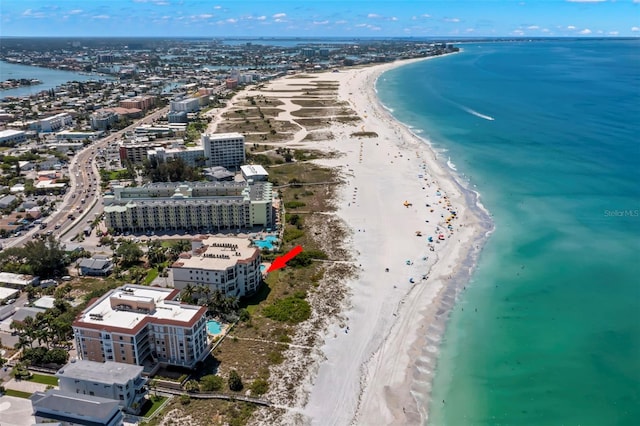 drone / aerial view featuring a beach view and a water view