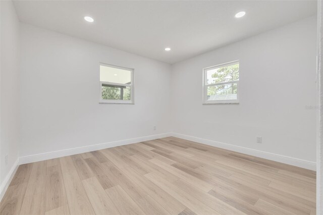 unfurnished room featuring light hardwood / wood-style floors