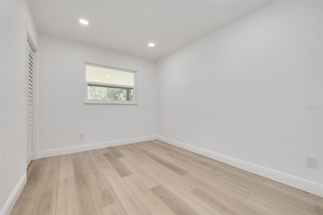 unfurnished room featuring light hardwood / wood-style flooring