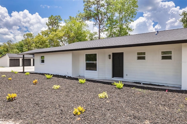 7414 Van Dyke Rd, Odessa, FL 33556 - view of front of home with roof with shingles and an outdoor structure