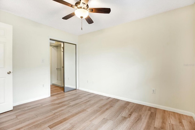 unfurnished bedroom with a closet, ceiling fan, and light hardwood / wood-style floors