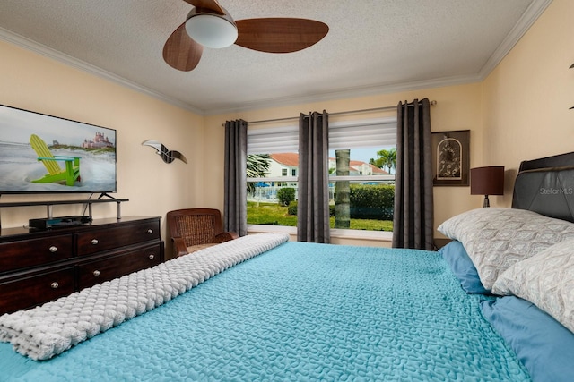 bedroom featuring a textured ceiling, ceiling fan, and crown molding