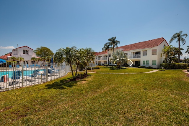 view of yard with a community pool