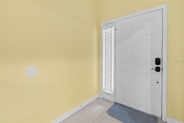 foyer entrance featuring light tile floors