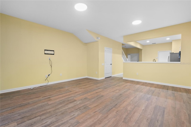 unfurnished living room featuring hardwood / wood-style floors